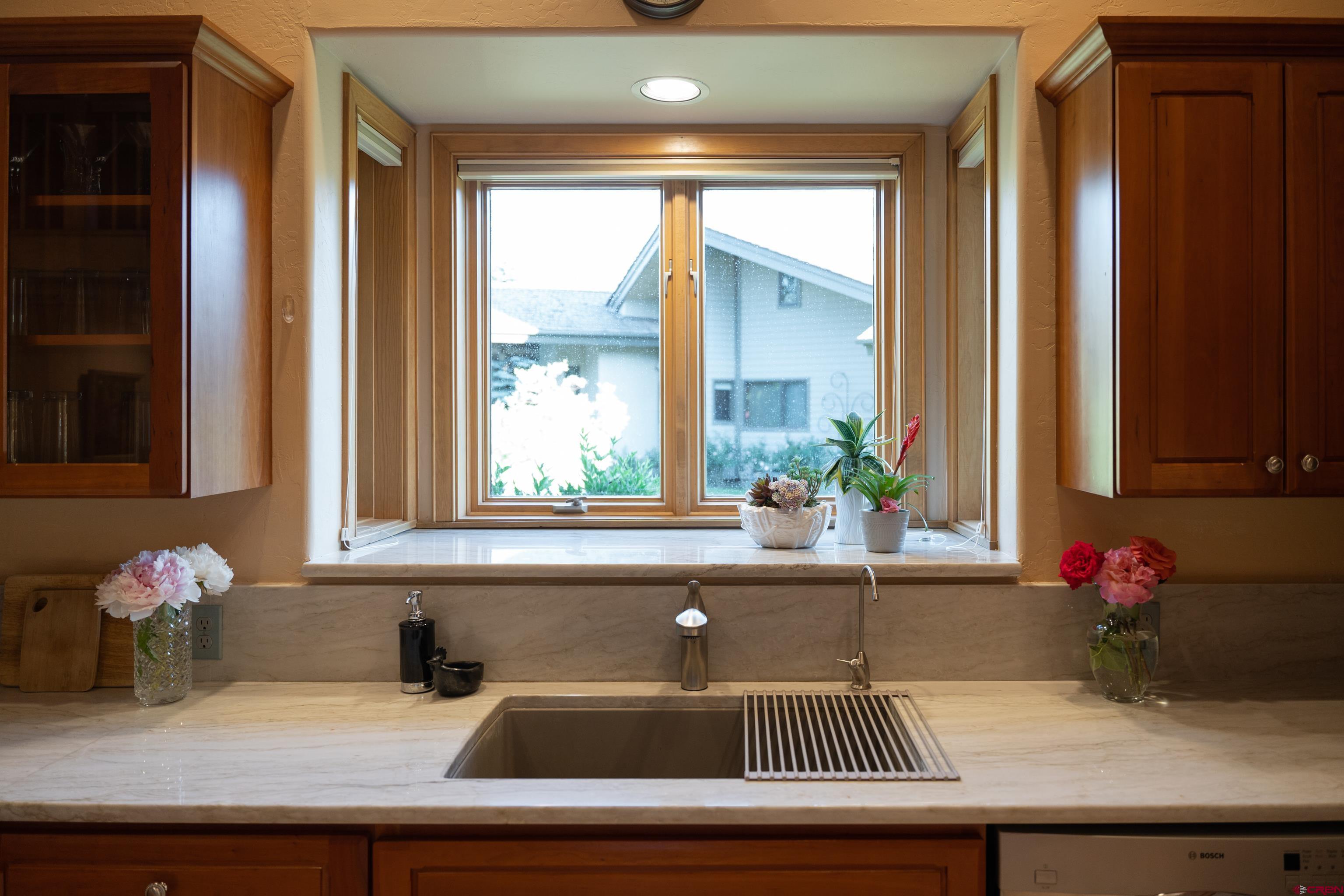 104 River Run Durango, CO 81301 - Photo 7 of 34 a kitchen with a sink and a window