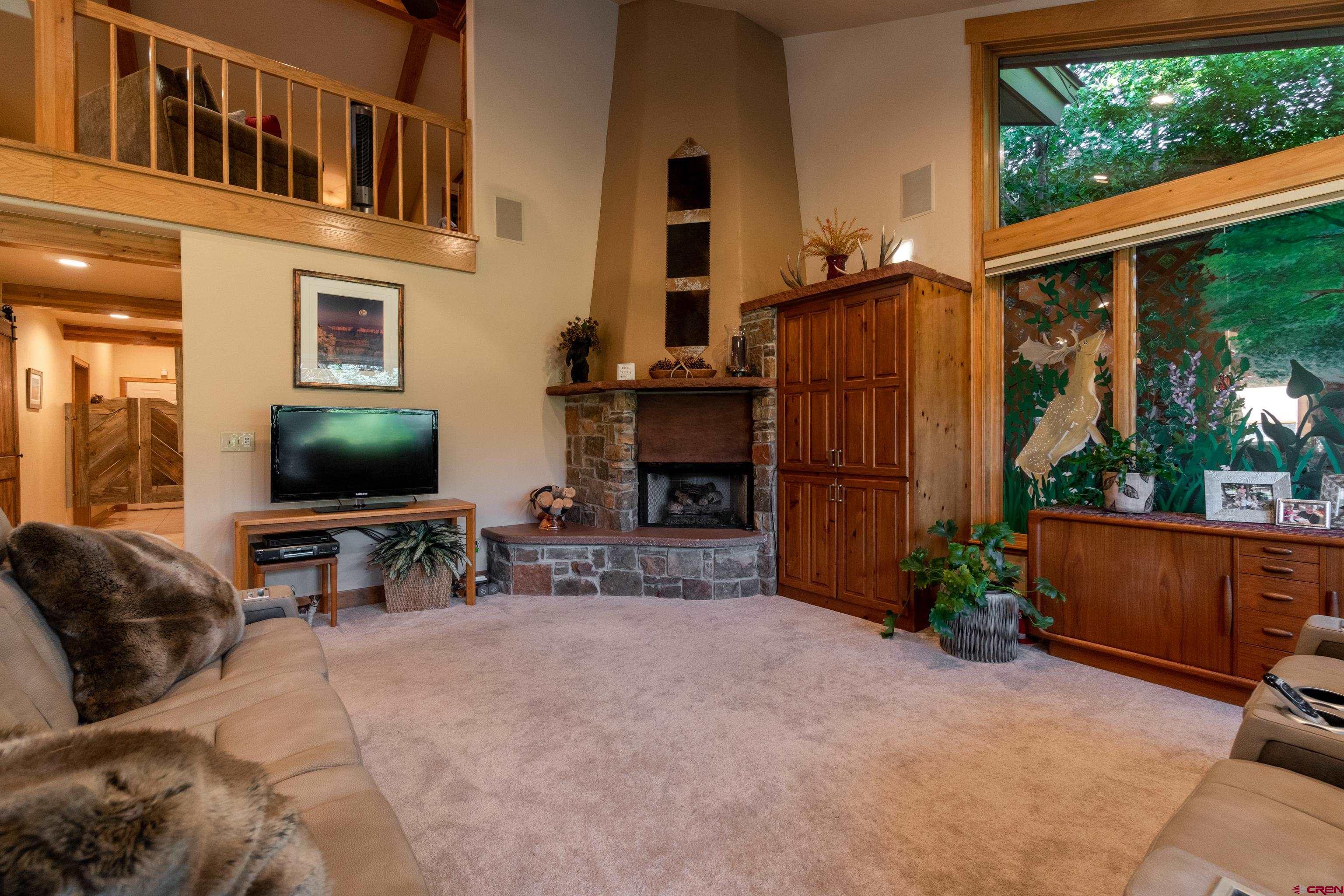 104 River Run Durango, CO 81301 - Photo 10 of 34 a living room with furniture and a flat screen tv