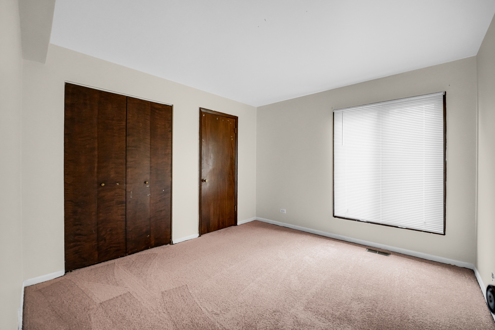 1100 Holbrook Road, Unit D Homewood, IL 60430 - Photo 13 of 16 a view of an empty room with window and closet area