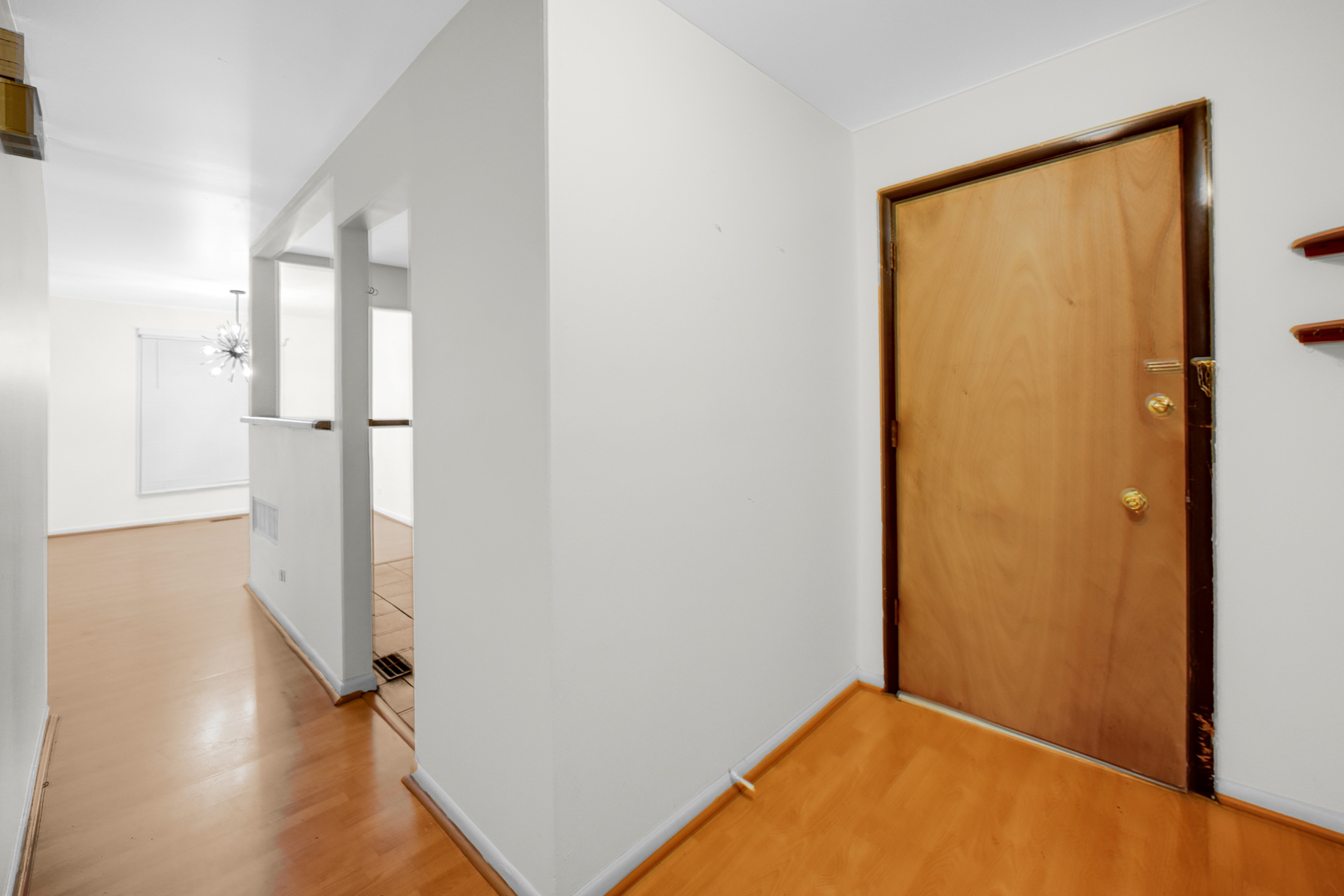 1100 Holbrook Road, Unit D Homewood, IL 60430 - Photo 9 of 16 a view of a room with wooden floor and entryway