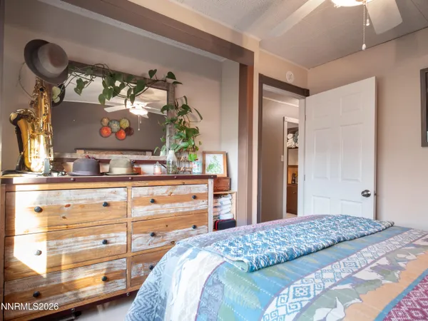 a bedroom with a bed and cabinets
