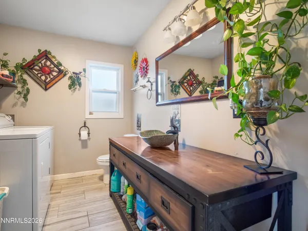 a room with furniture and painting on the wall