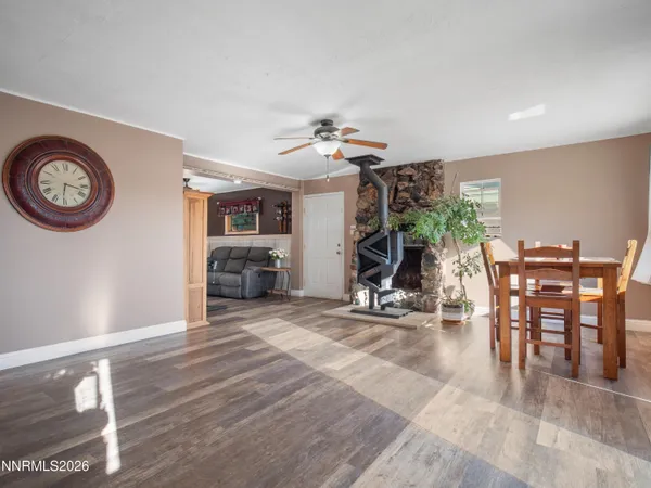 a view of a livingroom with furniture and a ceiling fan