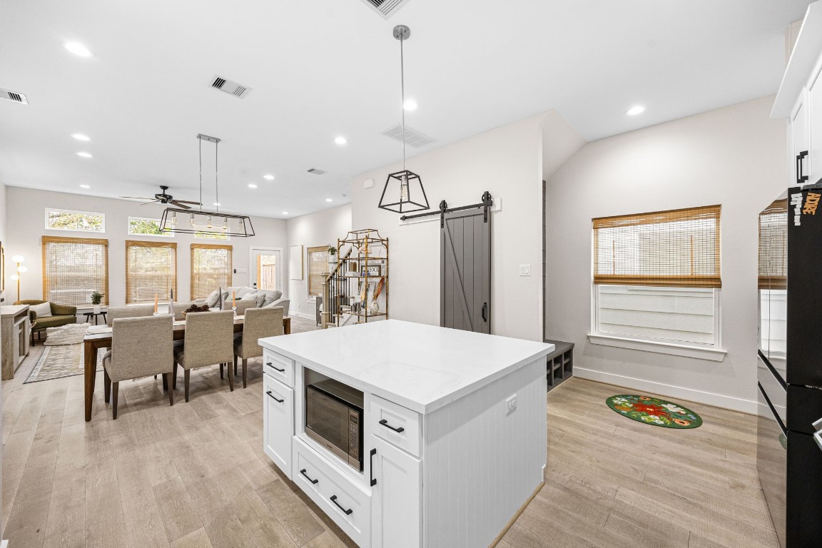 317 Sikes Street Houston, TX 77018 - Photo 12 of 30 Expansive open-concept living with 10' ceilings, seamless flow to kitchen, dining and living room.