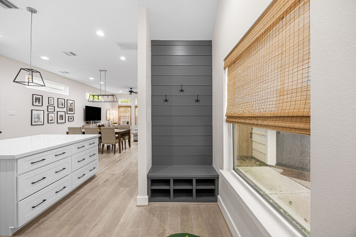317 Sikes Street Houston, TX 77018 - Photo 13 of 30 Custom gray shiplap drop zone, bench seating, shoe storage, and coat hooks.