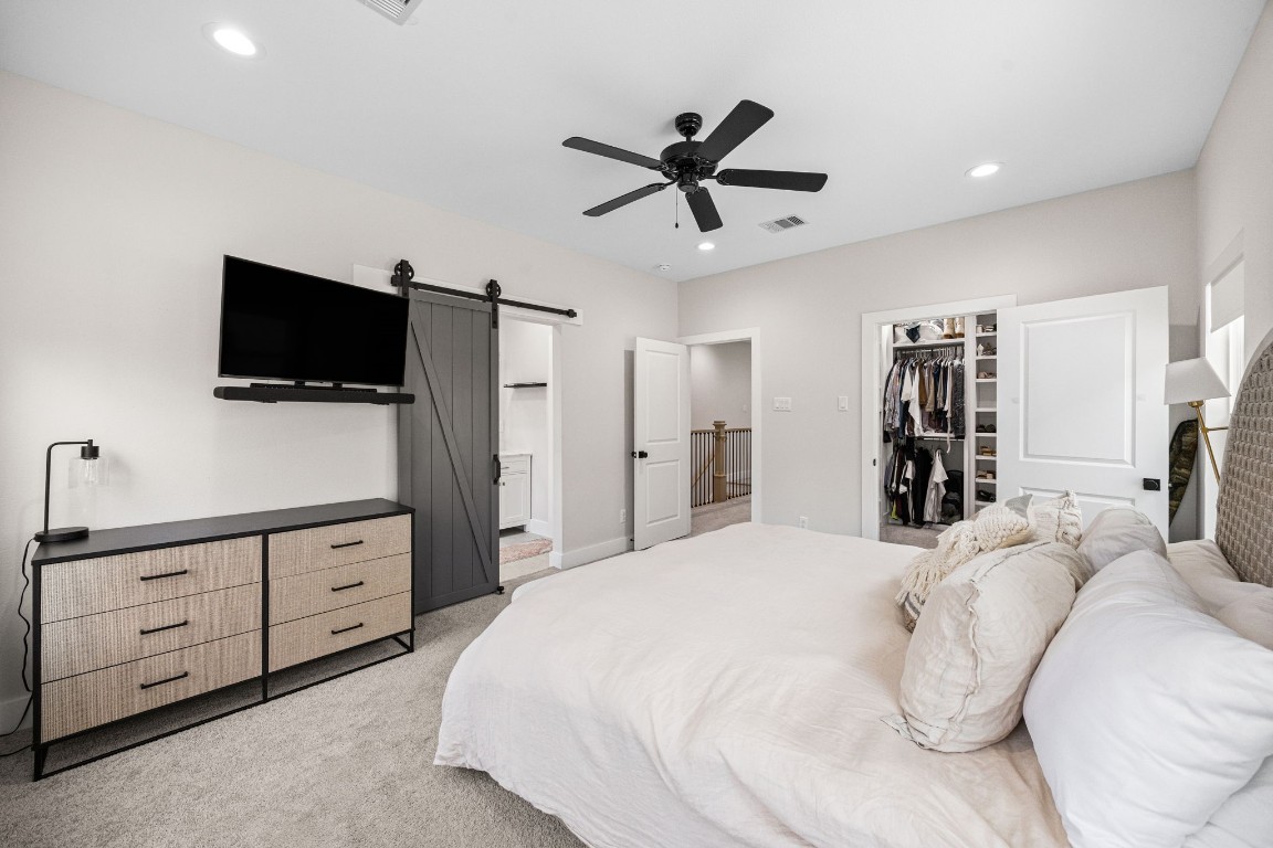 317 Sikes Street Houston, TX 77018 - Photo 20 of 30 Stylish barn door in primary bedroom leading to primary bathroom.