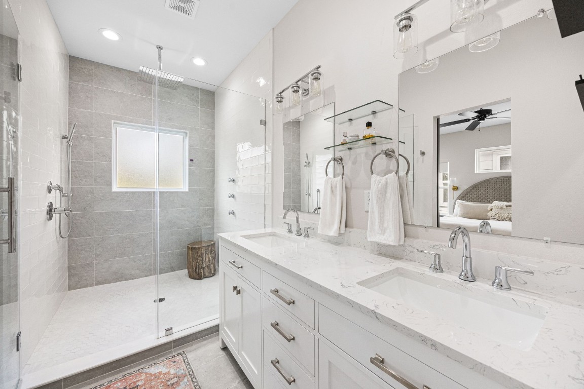 317 Sikes Street Houston, TX 77018 - Photo 21 of 30 Primary bathroom with double sinks and large walk-in frameless glass shower.