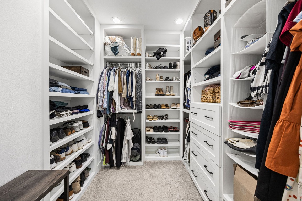 317 Sikes Street Houston, TX 77018 - Photo 23 of 30 well-designed and spacious layout optimized for maximum storage efficiency. The closet is equipped with Adjustable shelving, allowing for customizable storage solutions to accommodate various clothing items, accessories, and personal belongings, ensuring a neat and organized environment.