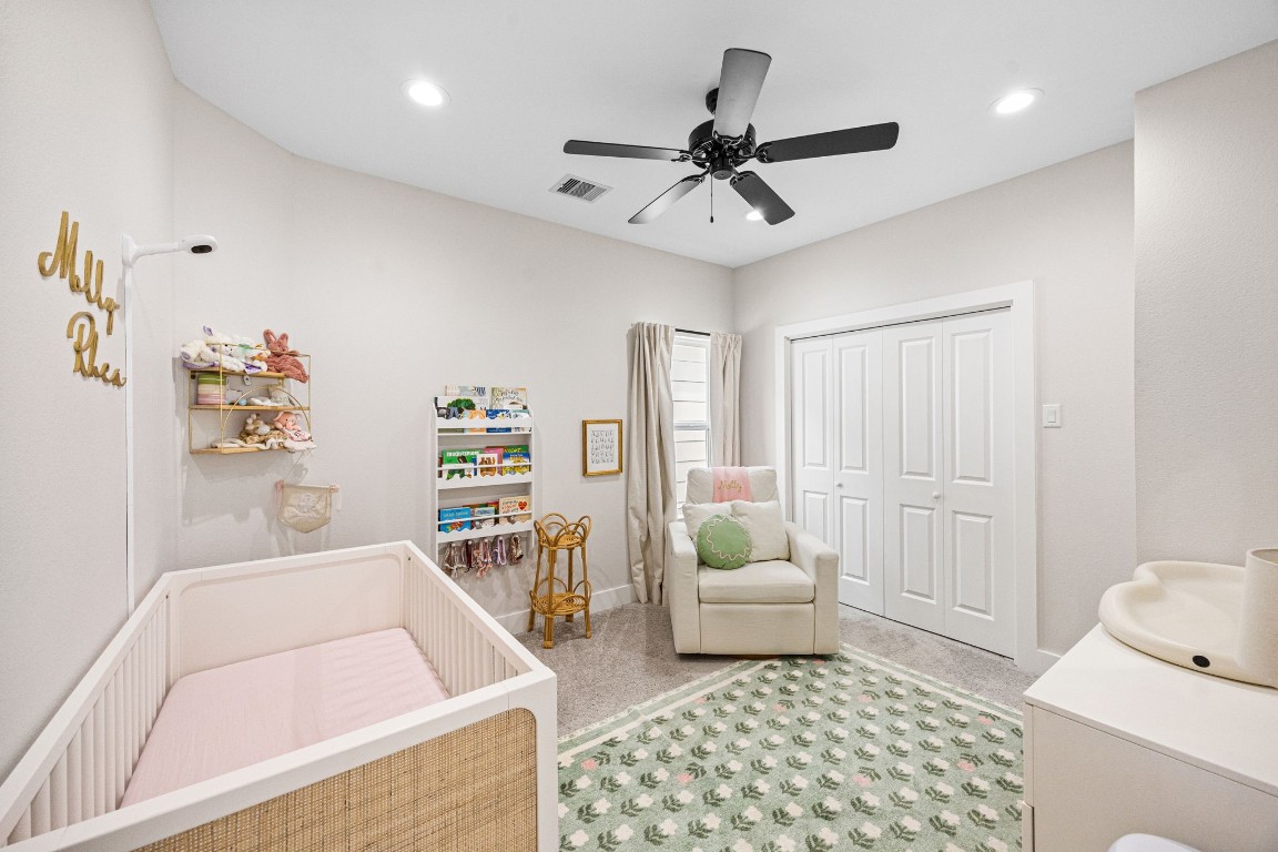 317 Sikes Street Houston, TX 77018 - Photo 26 of 30 This is a charming secondary bedroom with a ceiling fan, currently serving as a bright and inviting nursery.