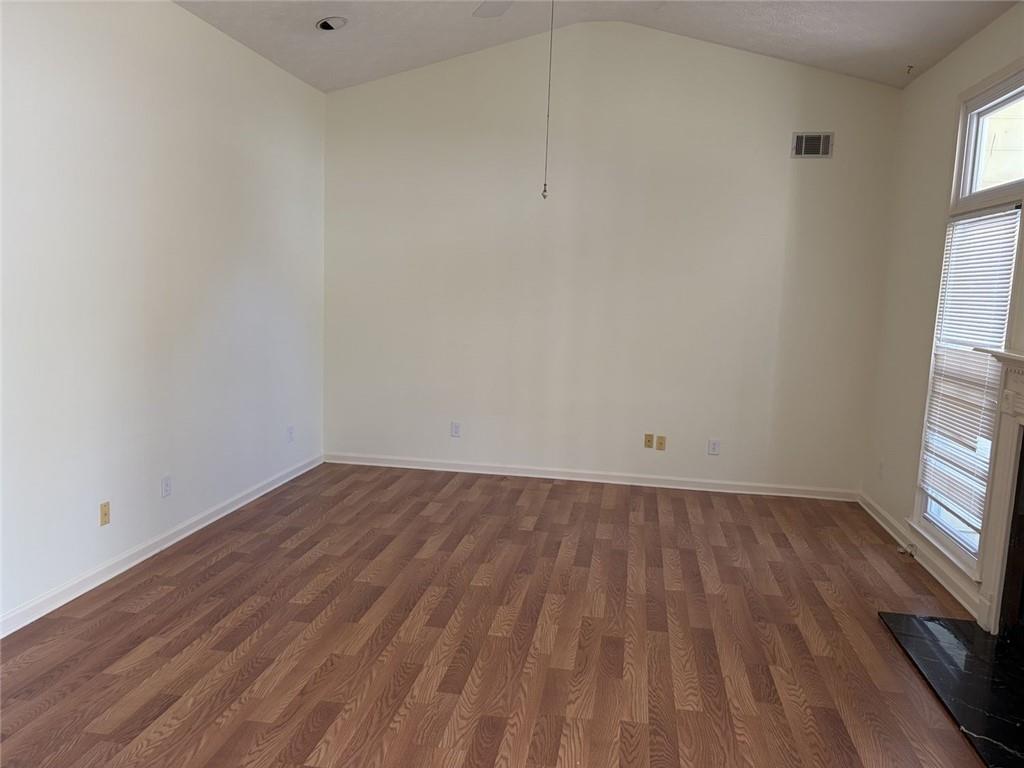 3089 Commons Crossing Snellville, GA 30078 - Photo 6 of 16 a view of a room that has wooden floor and window in it