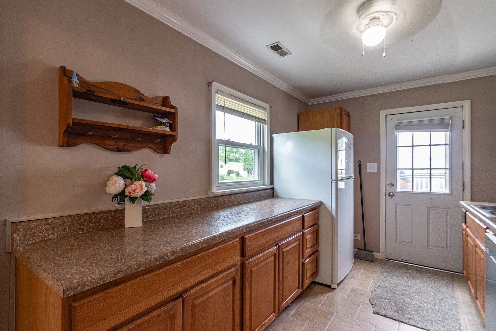 18229 West Big Oaks Road Grayslake, IL 60030 - Photo 11 of 22 a kitchen with stainless steel appliances granite countertop a sink and a refrigerator