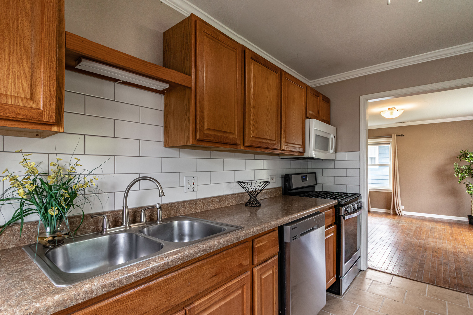 18229 West Big Oaks Road Grayslake, IL 60030 - Photo 12 of 22 a kitchen with stainless steel appliances granite countertop a sink and cabinets