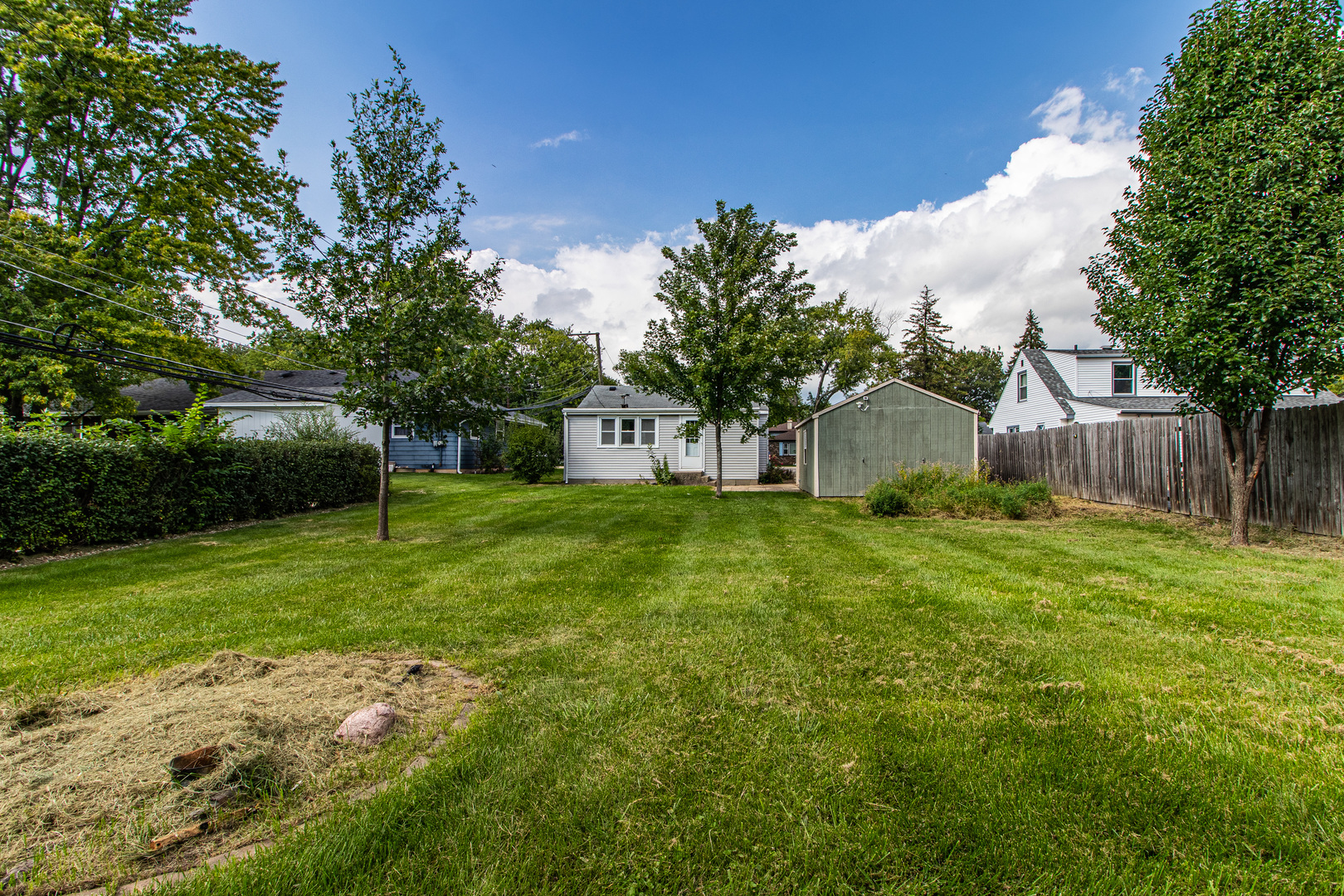 18229 West Big Oaks Road Grayslake, IL 60030 - Photo 20 of 22 a view of a house with backyard and sitting area