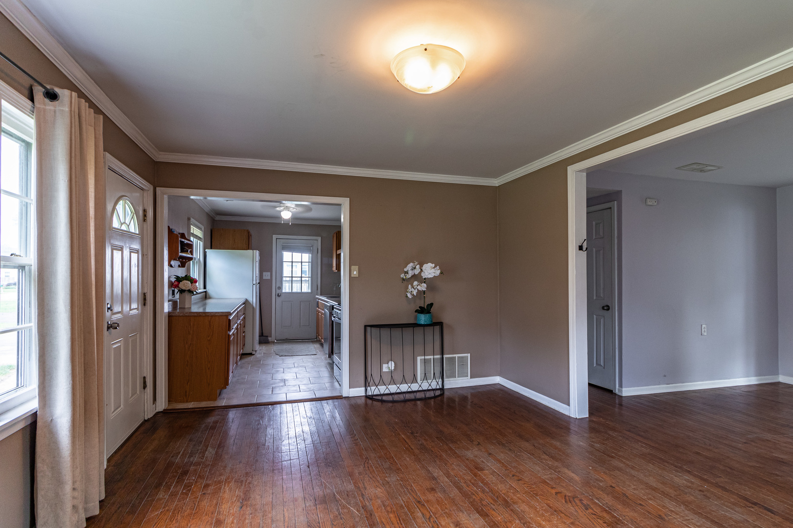 18229 West Big Oaks Road Grayslake, IL 60030 - Photo 5 of 22 a view of a livingroom with wooden floor and furniture