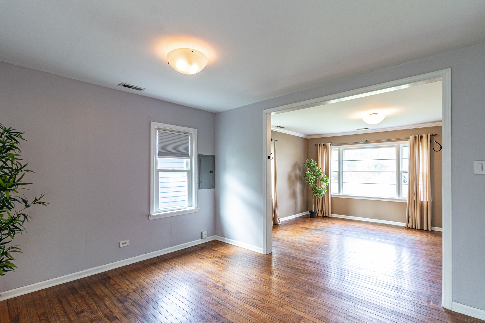 18229 West Big Oaks Road Grayslake, IL 60030 - Photo 8 of 22 a view of an empty room with window and wooden floor