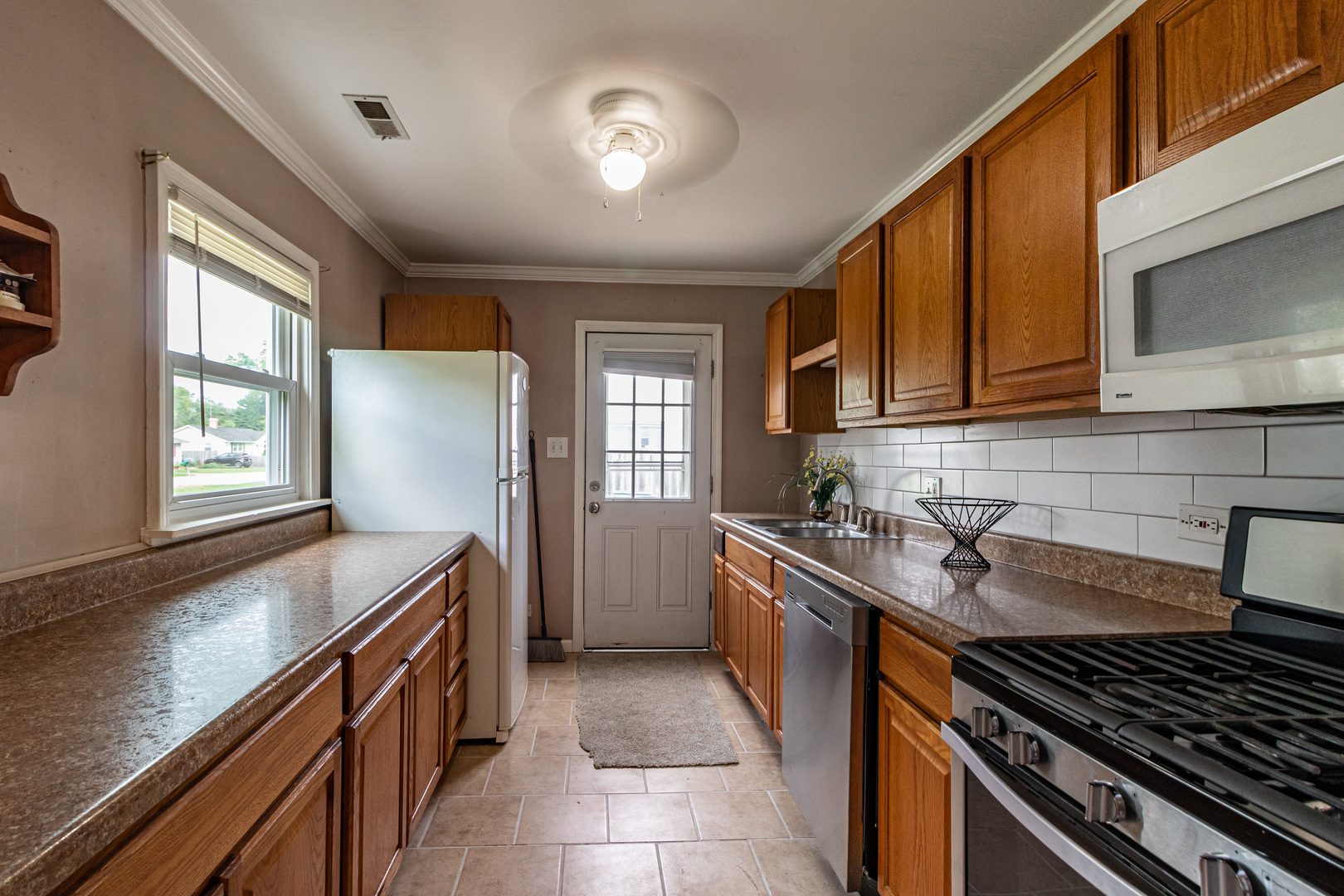 18229 West Big Oaks Road Grayslake, IL 60030 - Photo 9 of 22 a kitchen with a stove and a sink