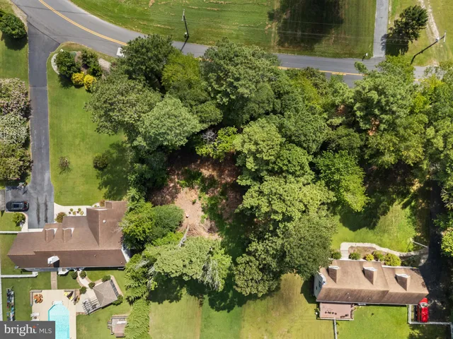 an aerial view of a house with swimming pool