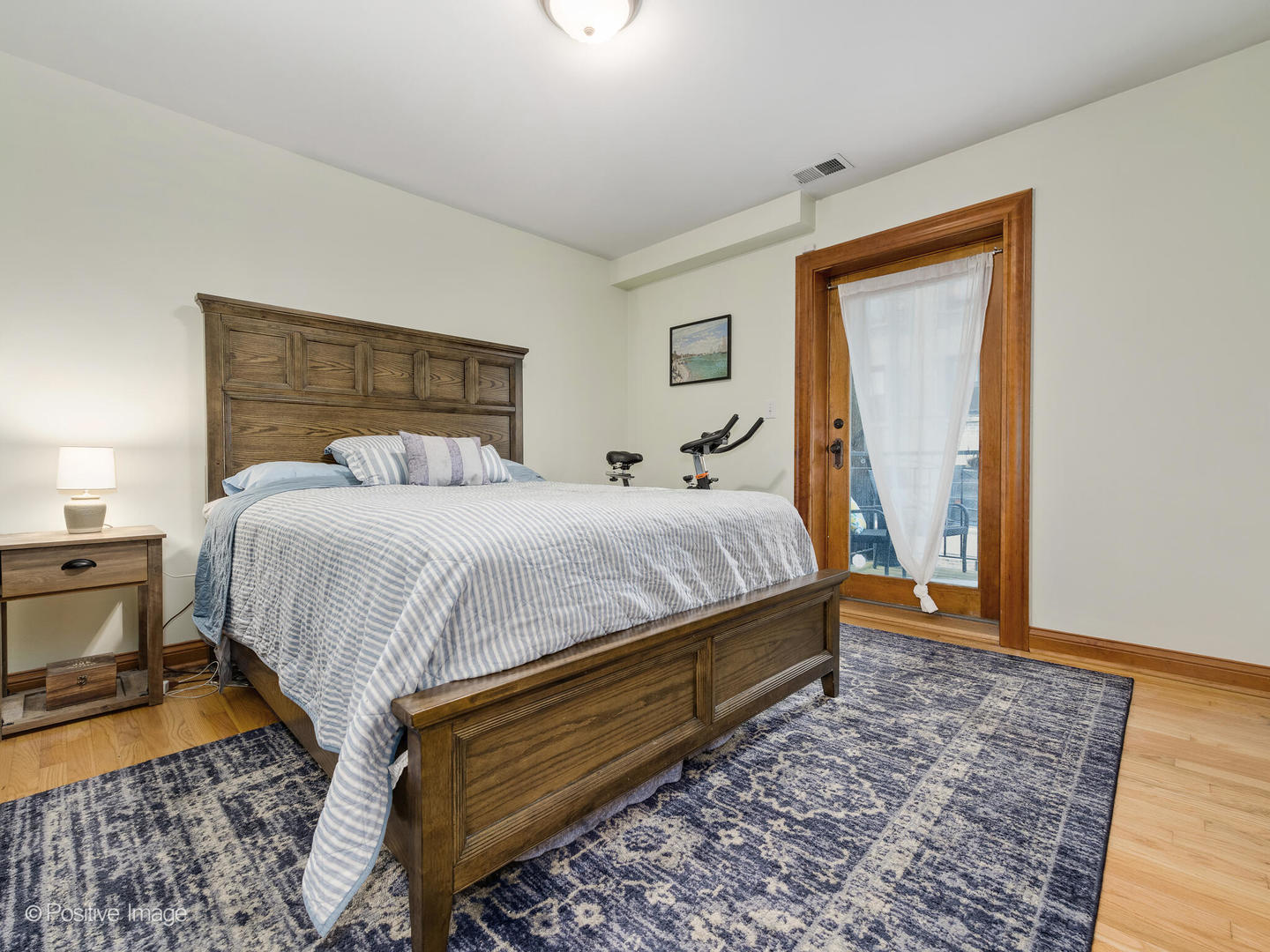 512 West Barry Avenue, Unit 312 Chicago, IL 60657 - Photo 11 of 12 a bedroom with double bed and a window
