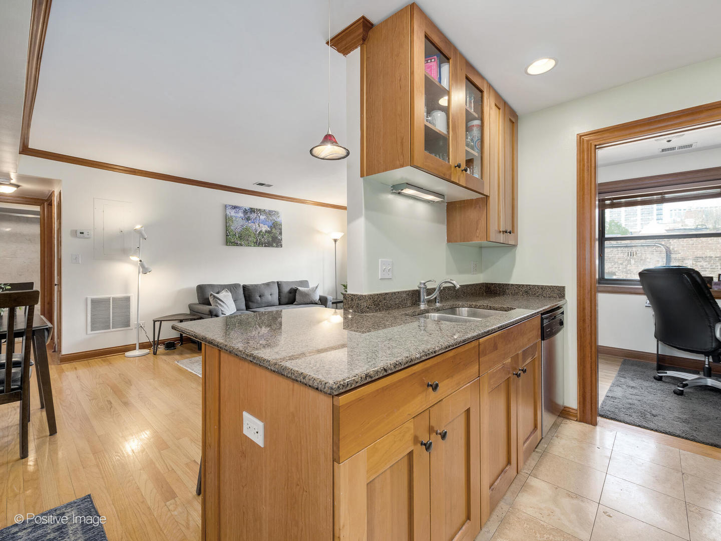512 West Barry Avenue, Unit 312 Chicago, IL 60657 - Photo 6 of 12 a kitchen with a stove a sink and a refrigerator