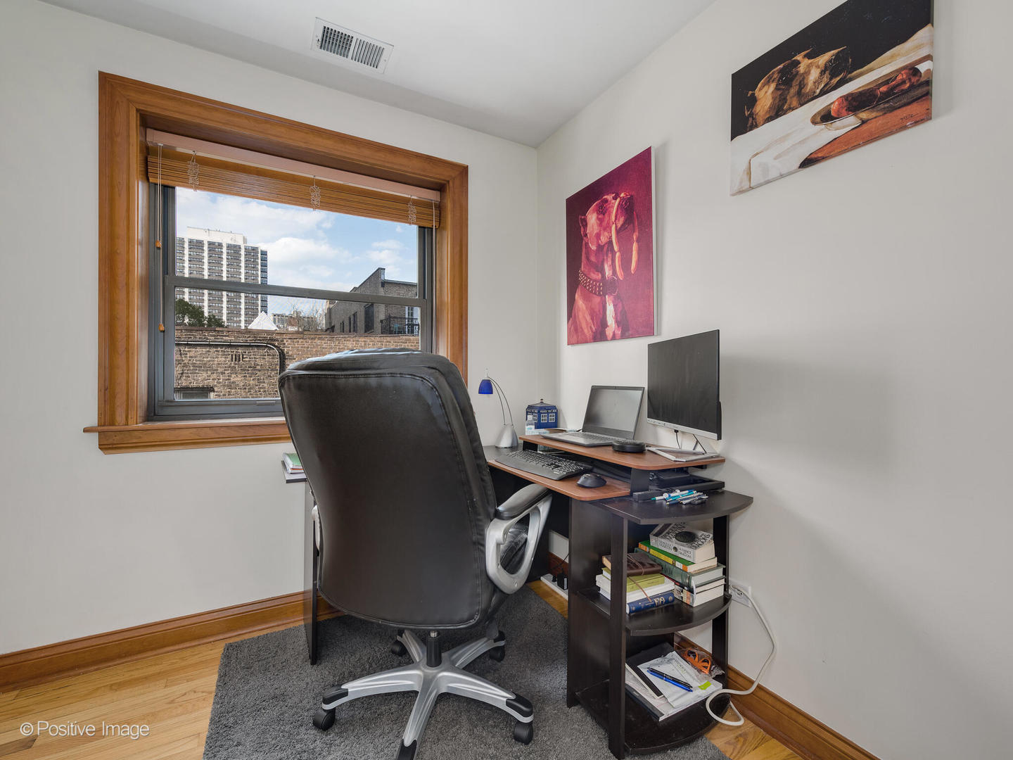 512 West Barry Avenue, Unit 312 Chicago, IL 60657 - Photo 9 of 12 a view of a workspace with furniture and a window