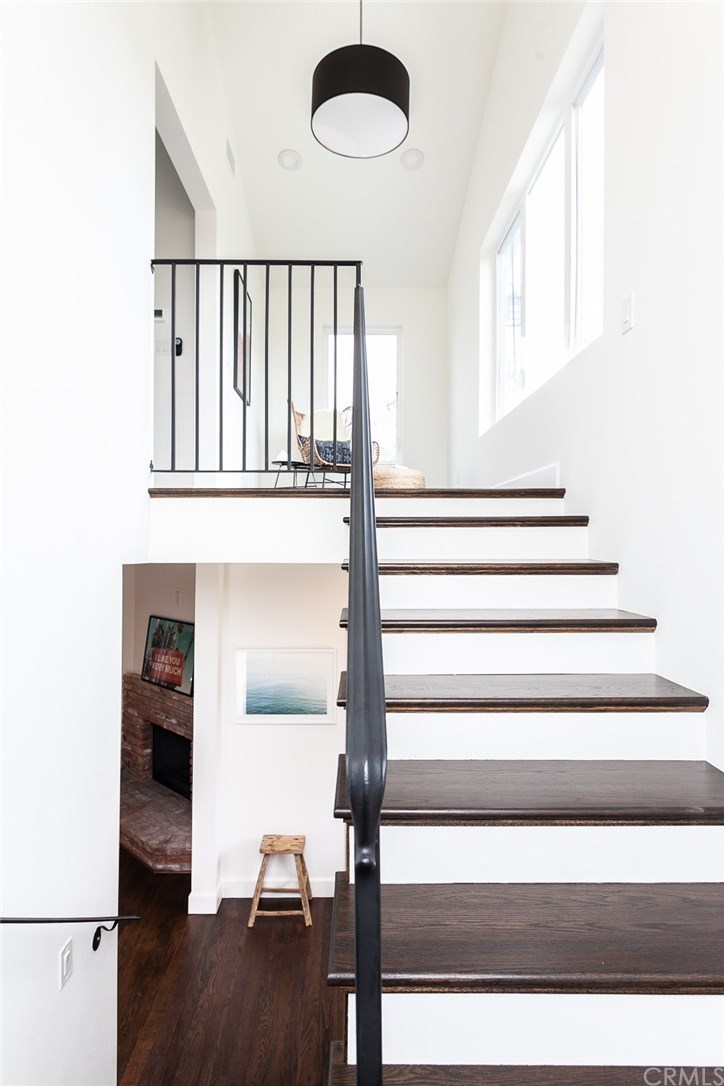 453 Broadway Costa Mesa, CA 92627 - Photo 13 of 39 a view of entryway and hall with wooden floor