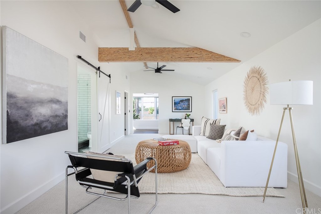 453 Broadway Costa Mesa, CA 92627 - Photo 16 of 39 a bedroom with a bed and a chandelier