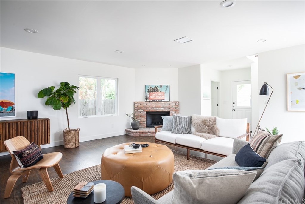 453 Broadway Costa Mesa, CA 92627 - Photo 2 of 39 a living room with furniture and a large window