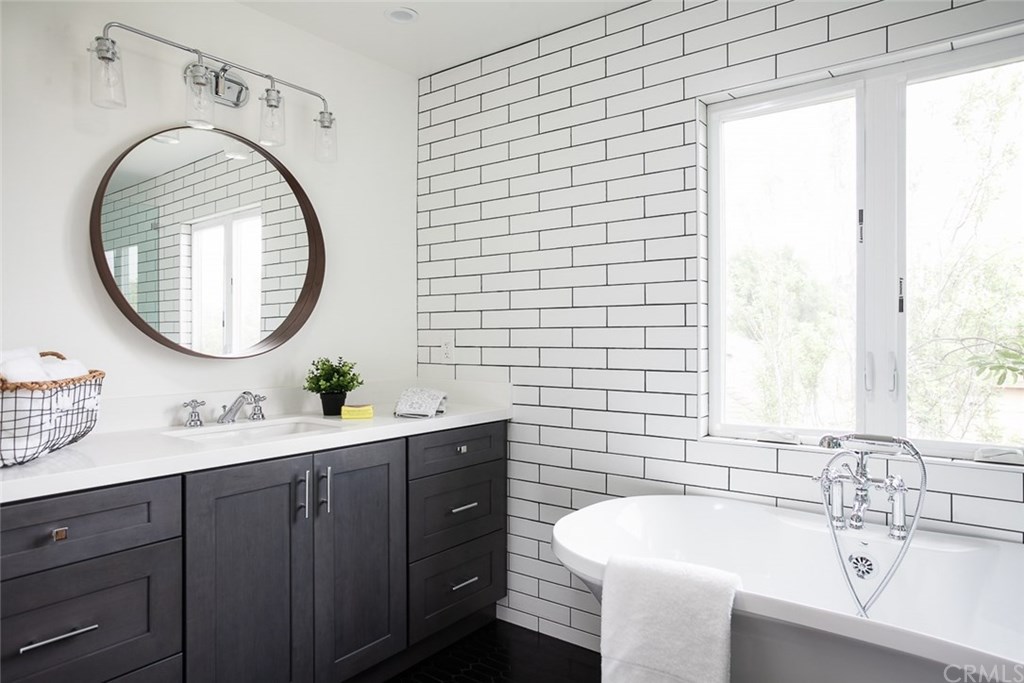 453 Broadway Costa Mesa, CA 92627 - Photo 22 of 39 a bathroom with a sink and a mirror