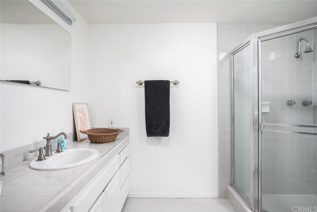 453 Broadway Costa Mesa, CA 92627 - Photo 25 of 39 a bathroom with a sink and a mirror