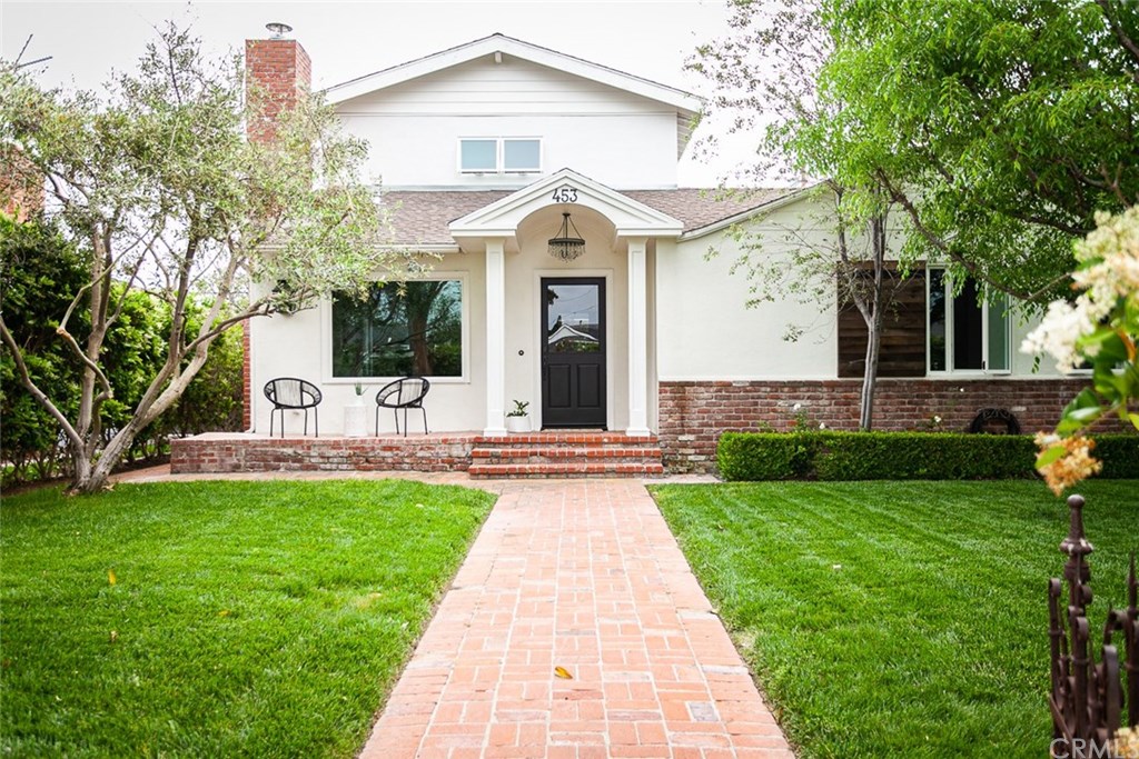 453 Broadway Costa Mesa, CA 92627 - Photo 34 of 39 a front view of a house with a garden and trees
