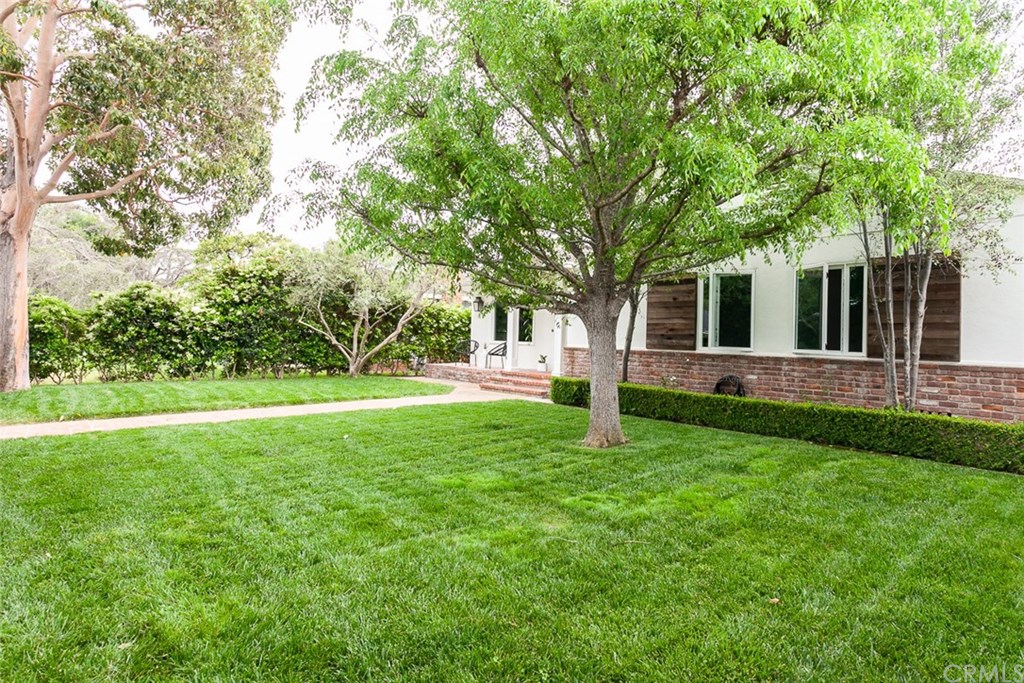 453 Broadway Costa Mesa, CA 92627 - Photo 37 of 39 a view of a house with backyard and a tree