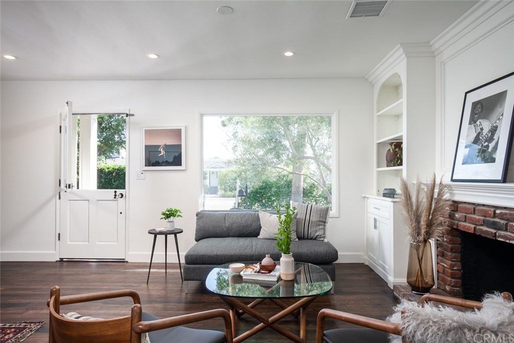 453 Broadway Costa Mesa, CA 92627 - Photo 5 of 39 a living room with furniture fireplace and a large window