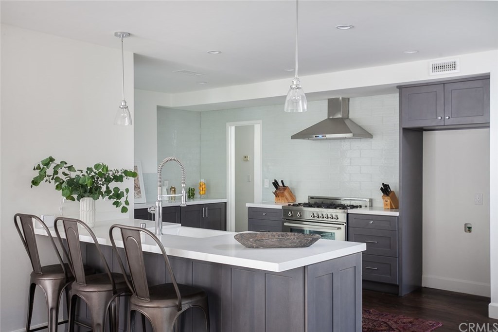 453 Broadway Costa Mesa, CA 92627 - Photo 9 of 39 a dining room with a table and chairs