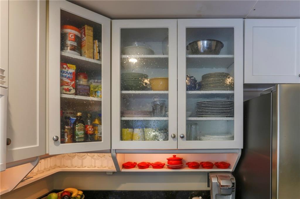 8 Pierce Street, Unit A Belfast, ME 04915 - Photo 13 of 34 Seeded-glass cabinet doors and lit...