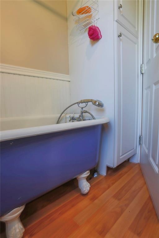 8 Pierce Street, Unit A Belfast, ME 04915 - Photo 22 of 34 Claw foot tub and cabinet