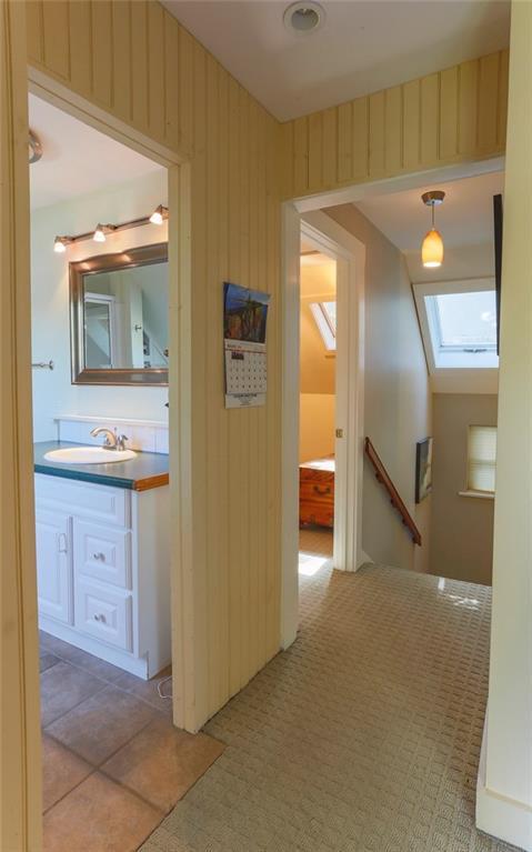 8 Pierce Street, Unit A Belfast, ME 04915 - Photo 25 of 34 Stairway with skylight to...