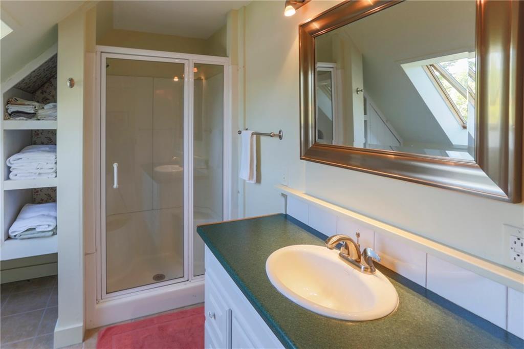 8 Pierce Street, Unit A Belfast, ME 04915 - Photo 28 of 34 Shower and open storage.