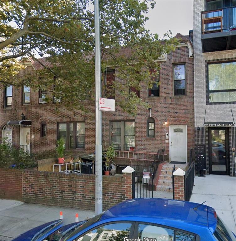 a view of a patio with table and chairs and potted plants