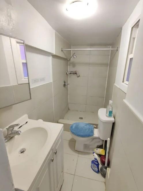 354 Rutland Road Brooklyn, NY 11225 - Photo 13 of 50 a bathroom with a sink toilet and shower