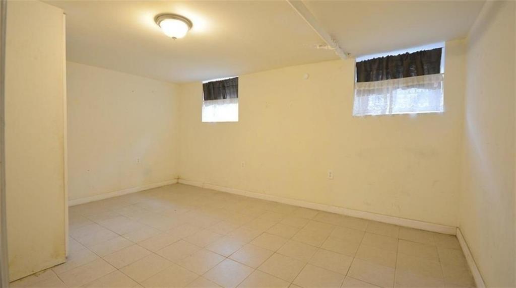 354 Rutland Road Brooklyn, NY 11225 - Photo 30 of 50 an empty room with a window
