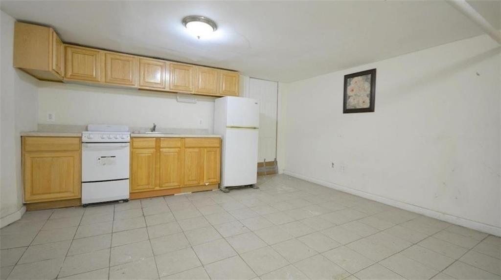 354 Rutland Road Brooklyn, NY 11225 - Photo 31 of 50 a view of cabinets and window in a room