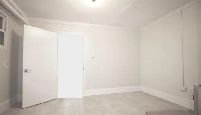 a living room with furniture and window