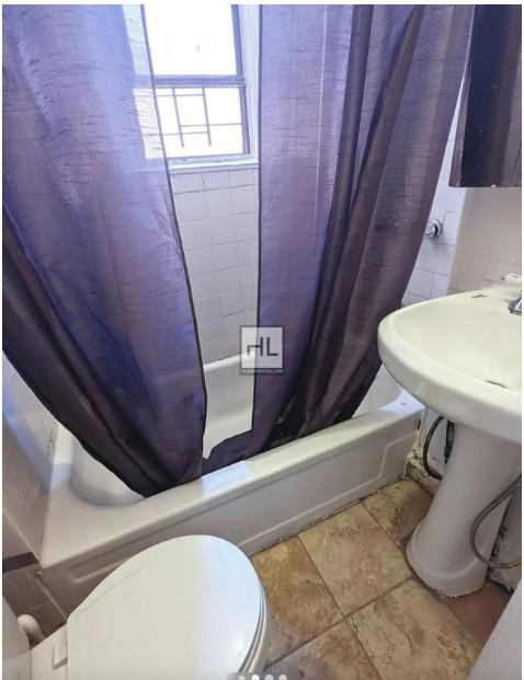 354 Rutland Road Brooklyn, NY 11225 - Photo 9 of 50 a bathroom with a sink and a mirror