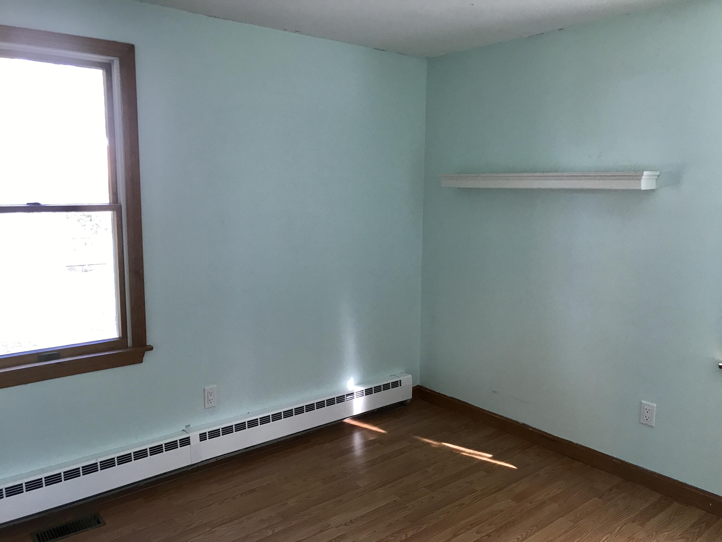 24 Papnomett Road Mashpee, MA 02649 - Photo 13 of 28 a view of an empty room with wooden floor and a window