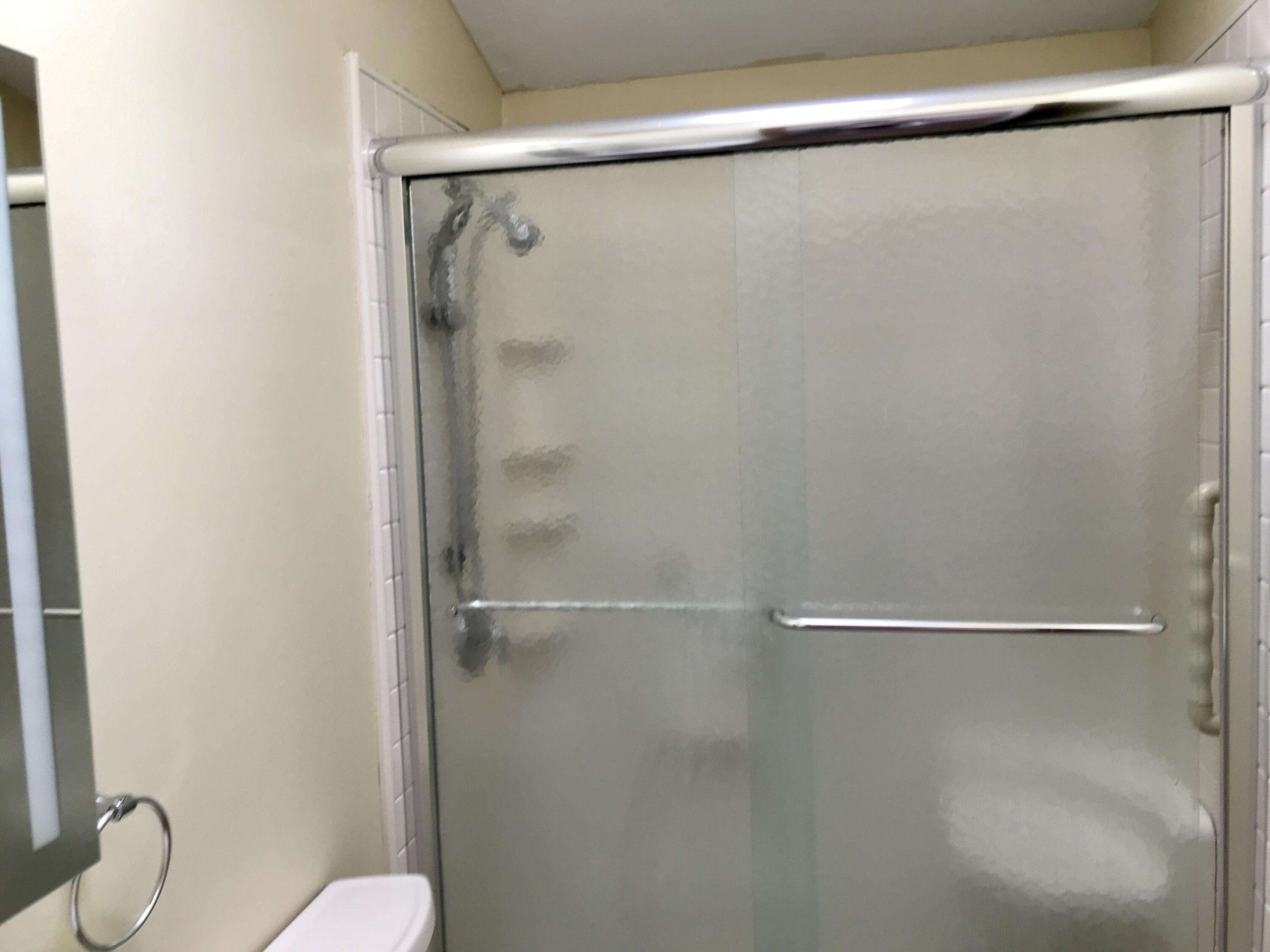 24 Papnomett Road Mashpee, MA 02649 - Photo 18 of 28 a bathroom with a shower and a toilet