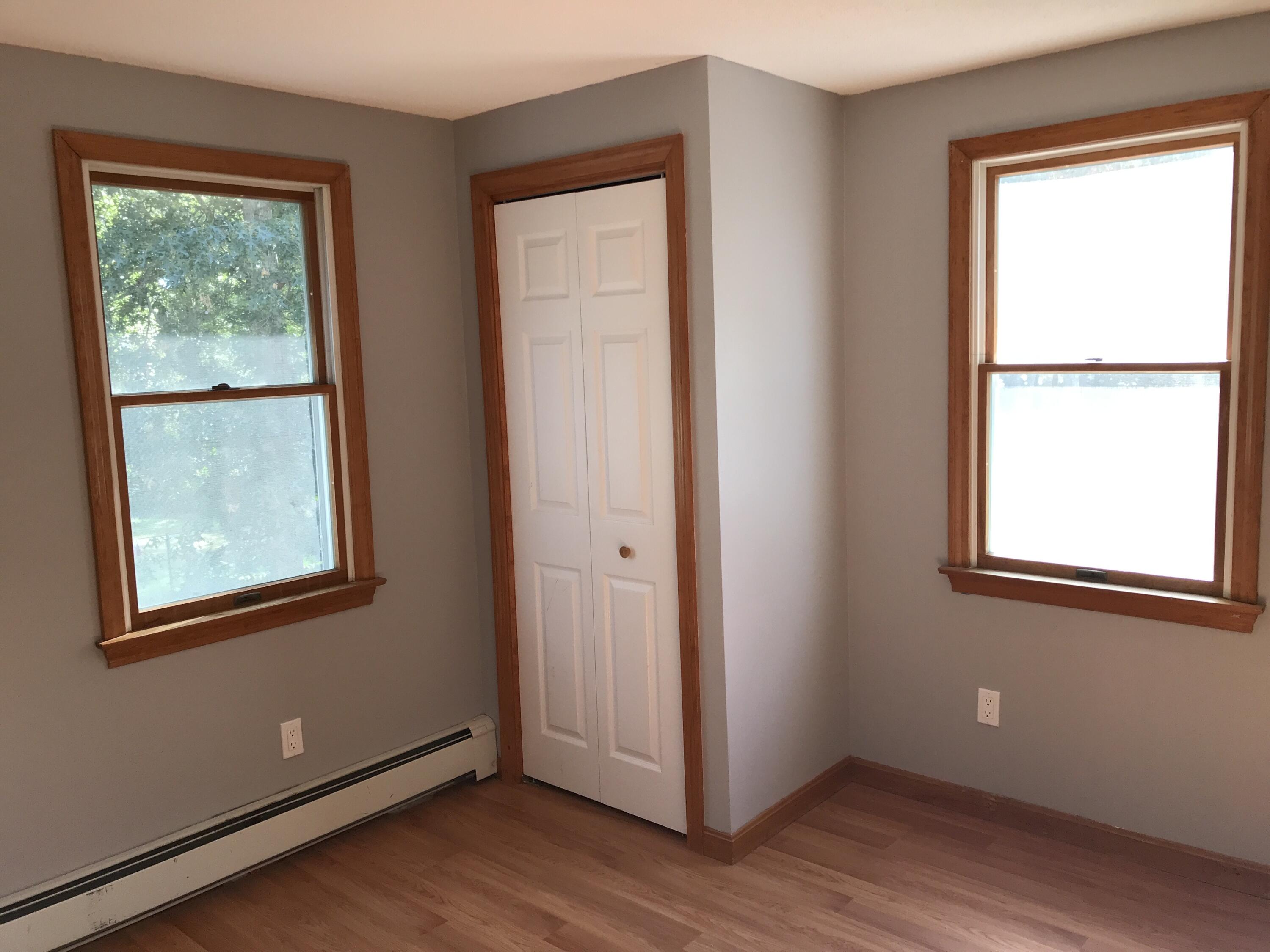 24 Papnomett Road Mashpee, MA 02649 - Photo 20 of 28 a view of an empty room with wooden floor and a window