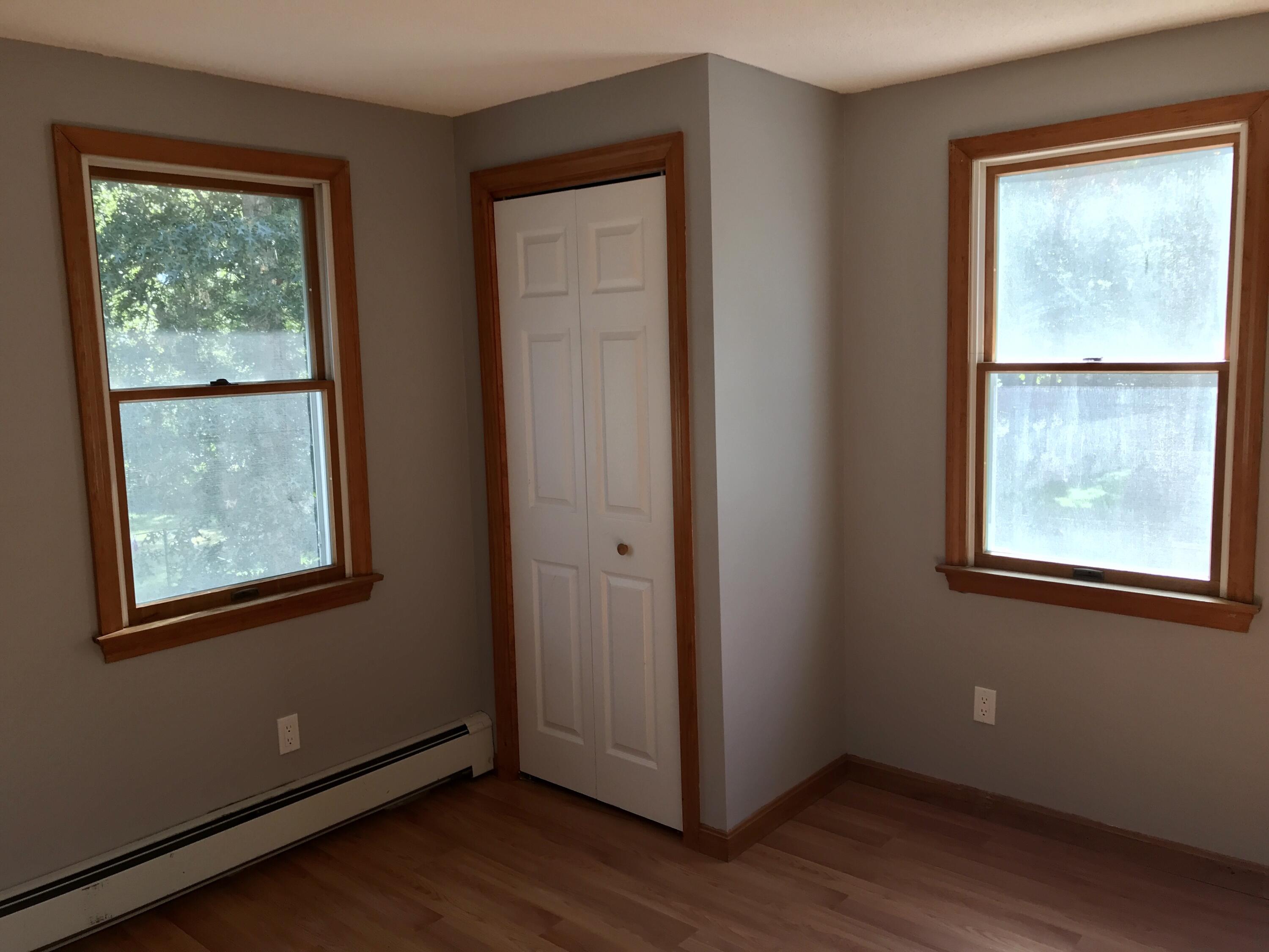 24 Papnomett Road Mashpee, MA 02649 - Photo 22 of 28 a view of an empty room with wooden floor and a window