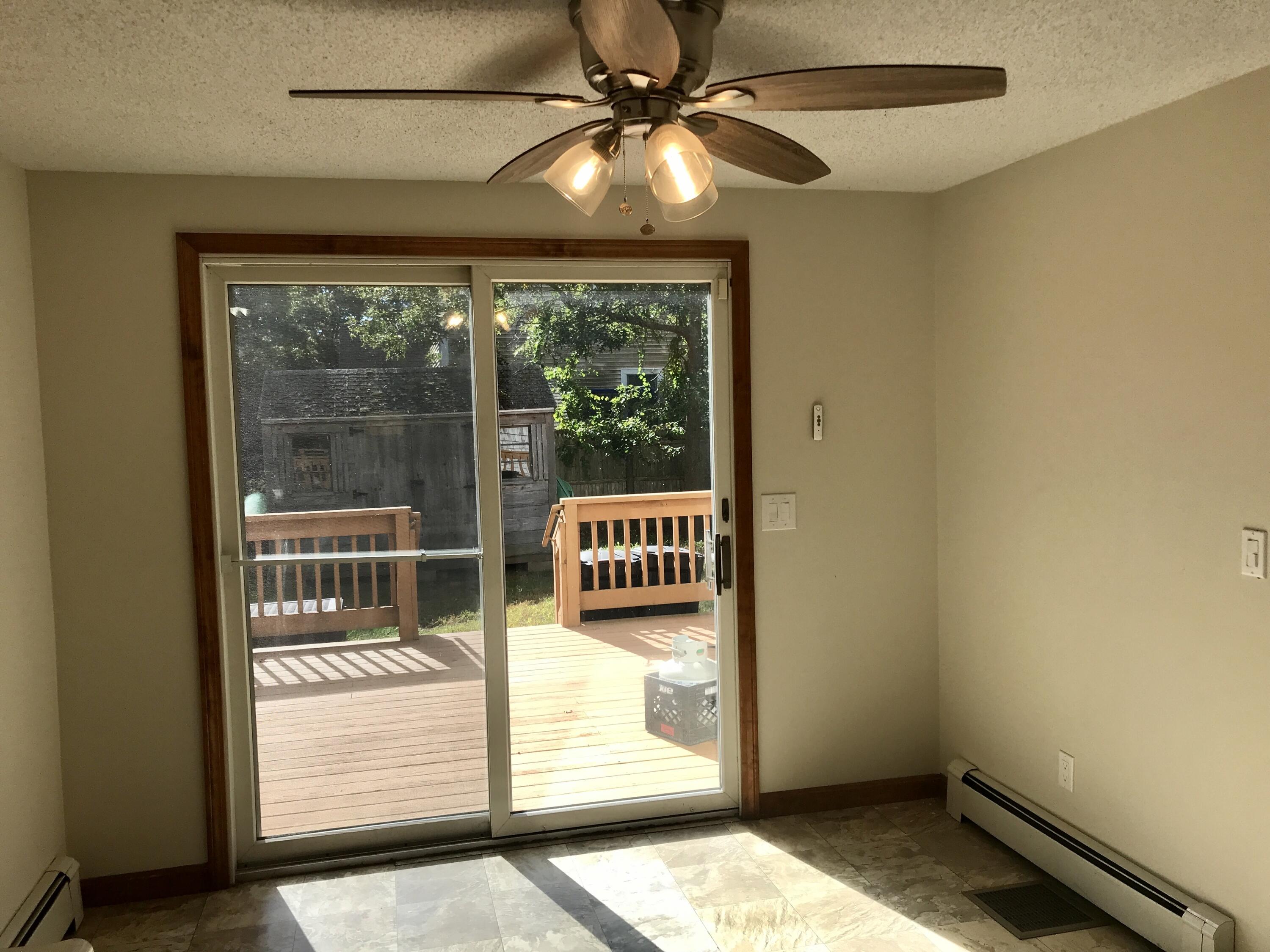 24 Papnomett Road Mashpee, MA 02649 - Photo 7 of 28 a view of a porch with a table and chairs