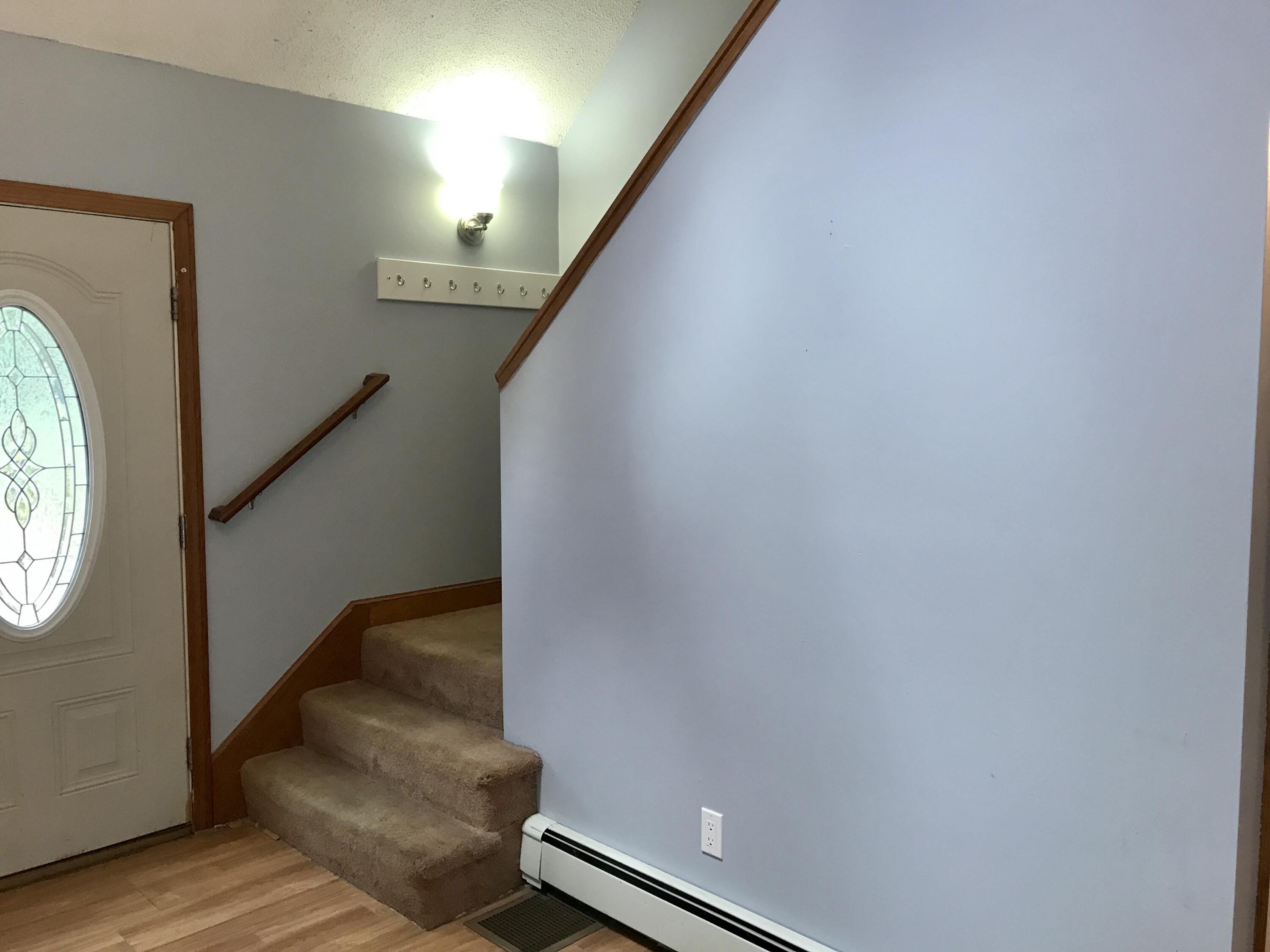 24 Papnomett Road Mashpee, MA 02649 - Photo 9 of 28 a hallway with stairs and a window