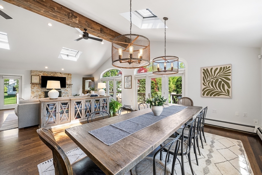 60 Perry Drive Westwood, MA 02090 - Photo 16 of 42 a view of a dining room and livingroom with furniture wooden floor a chandelier